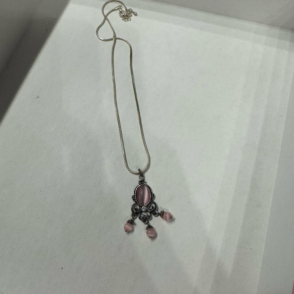 Silver necklace with pink charm